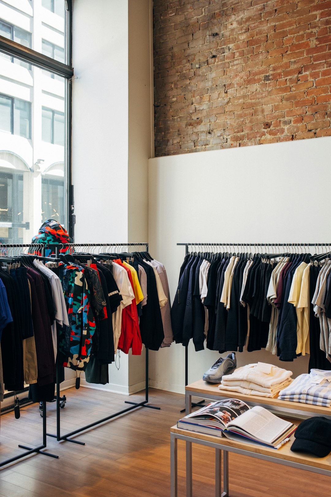 assorted-color-clothes-hanging-on-metal-racks-4k7bwahugc
